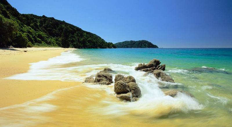Calm azure sea, lapping a golden beach